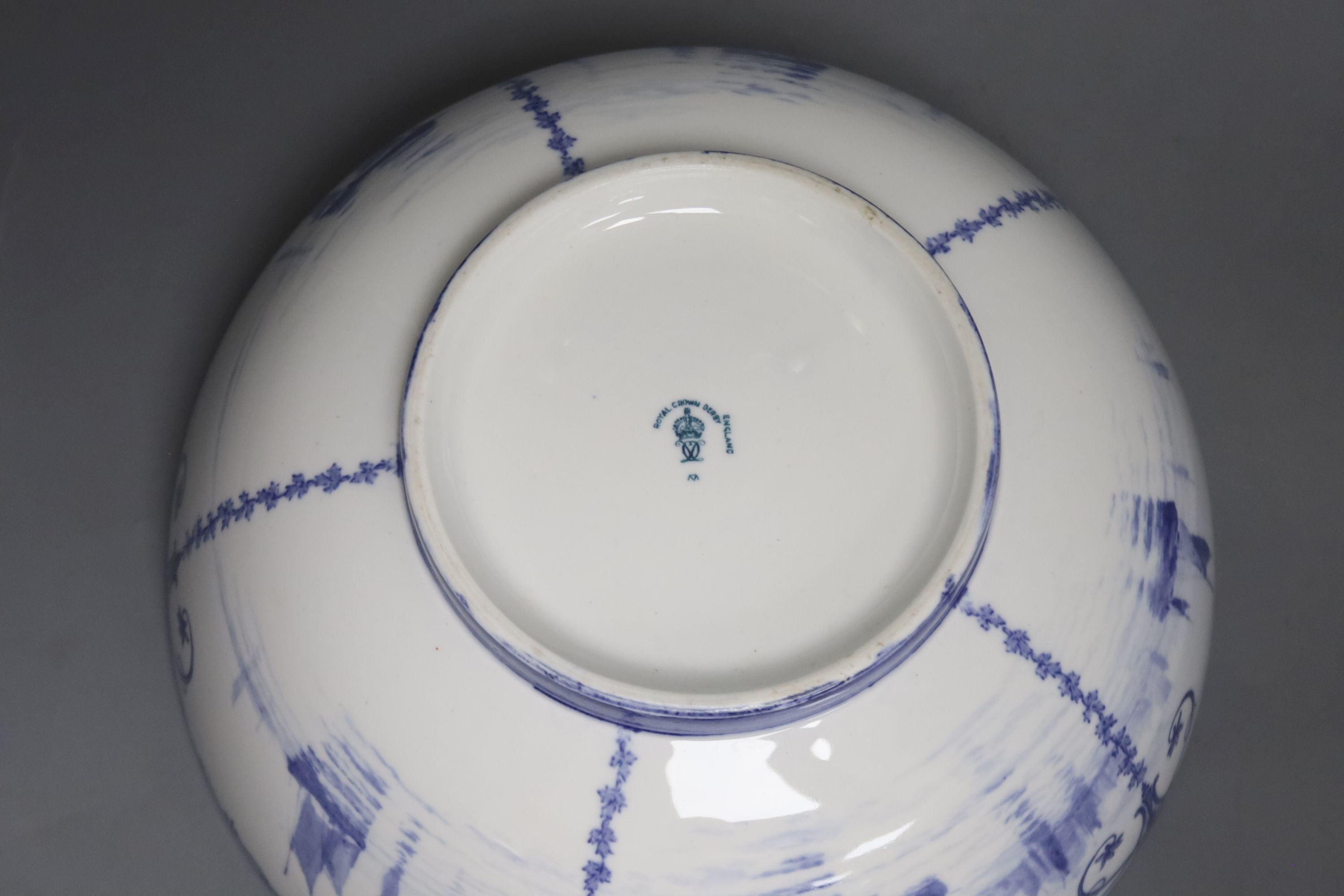 A Royal Crown Derby blue and white bowl painted with sailing scenes, by W.E.J. Dean, diameter 23cm